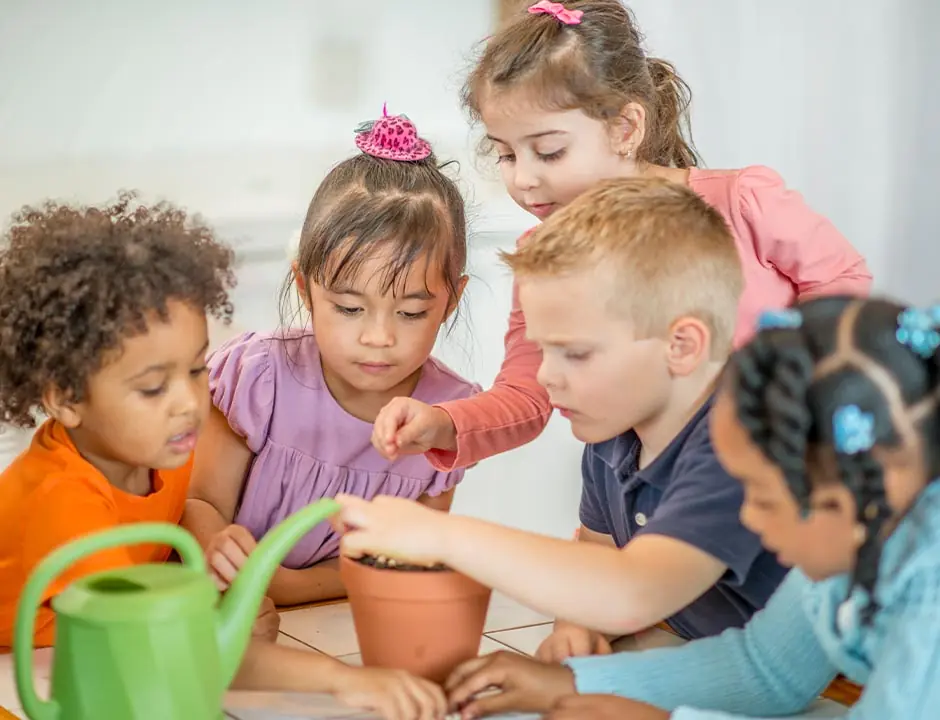 Children planting a plant